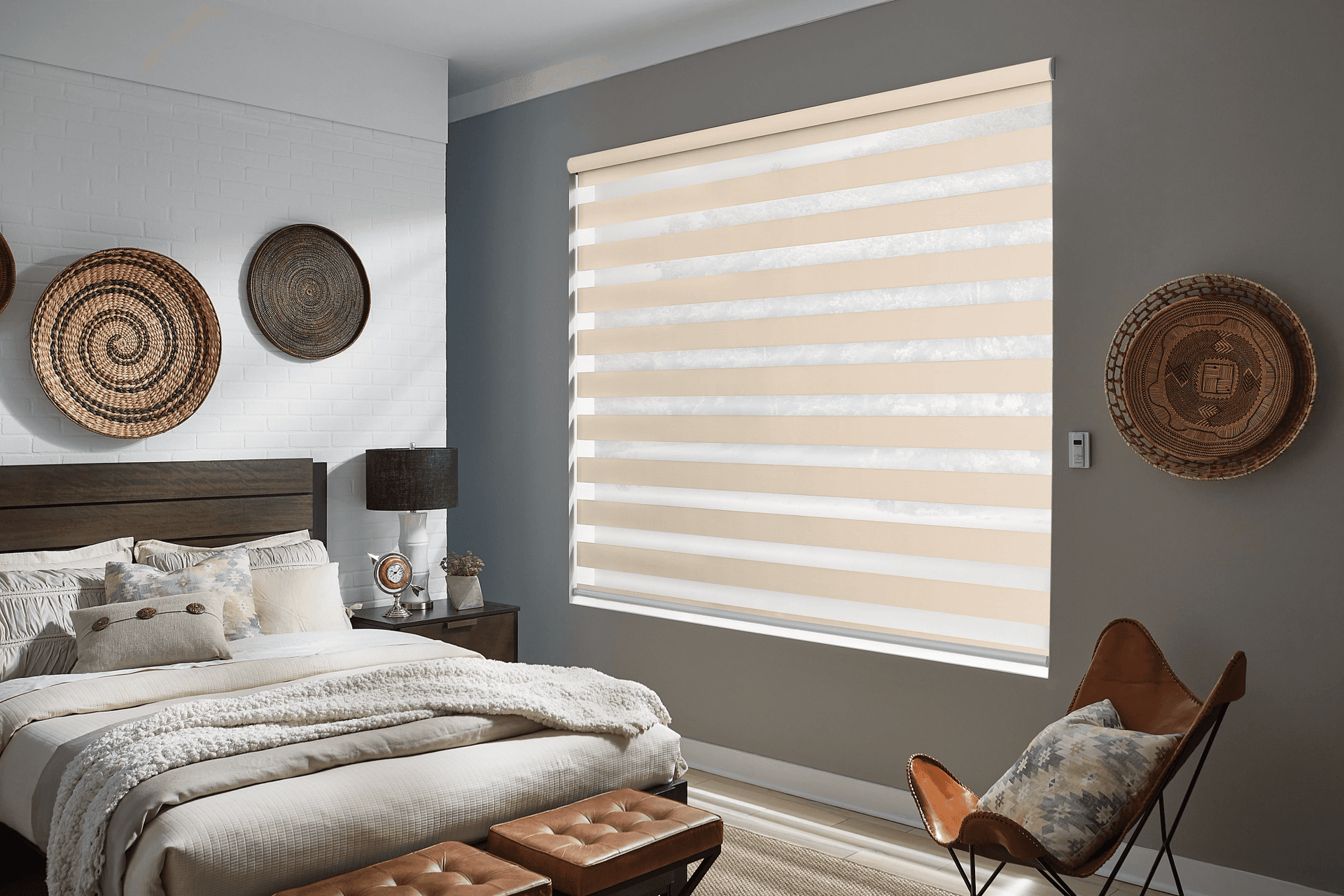 Tan layered zebra shades across a large bedroom window by Graber Blinds