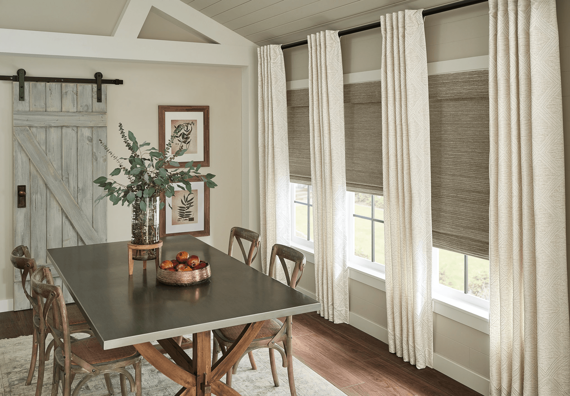 Graber neutral draperies over natural woven wood shades