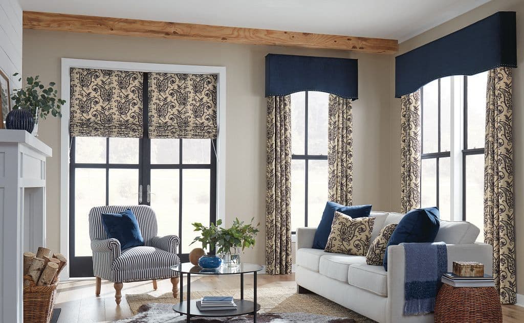 Horizons roman shades and custom draperies with a partial arch fabric wrapped cornice