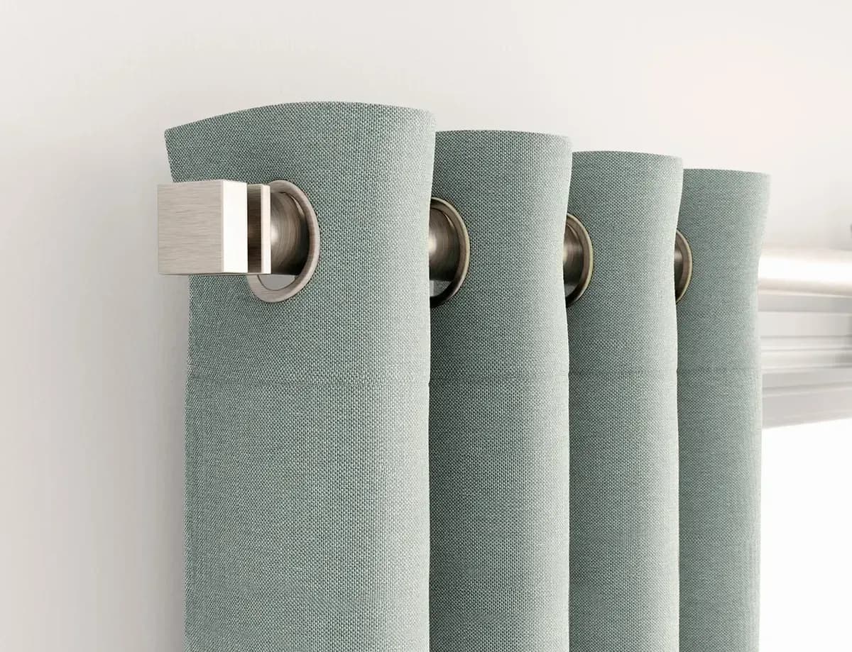 Sunbrella mark drapery fabric with square finial and grommet rings