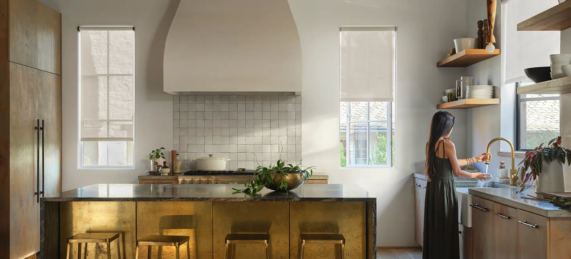 Sunbrella Lifestyle solar shades in modern luxury gold kitchen